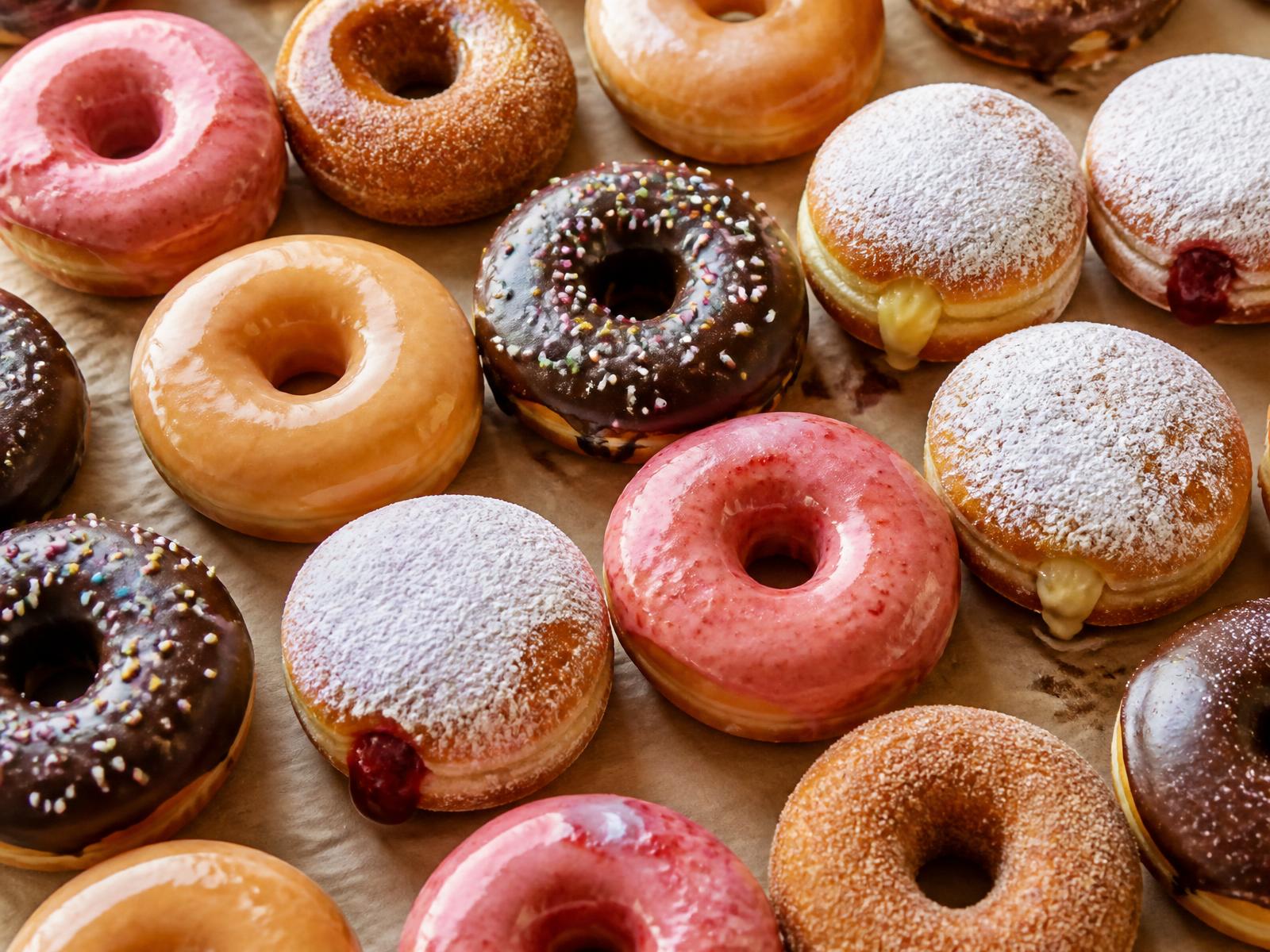 A tray of freshly glazed donuts at Yummy's Donut Palace